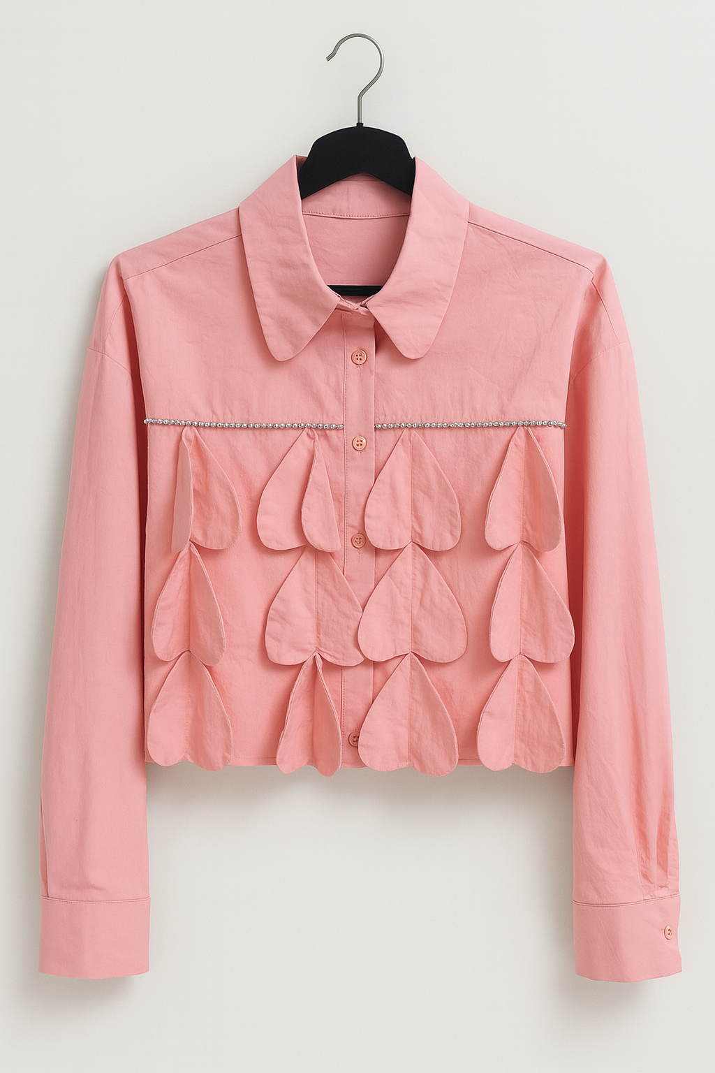 Short pink blouse with long sleeves and fabric hearts