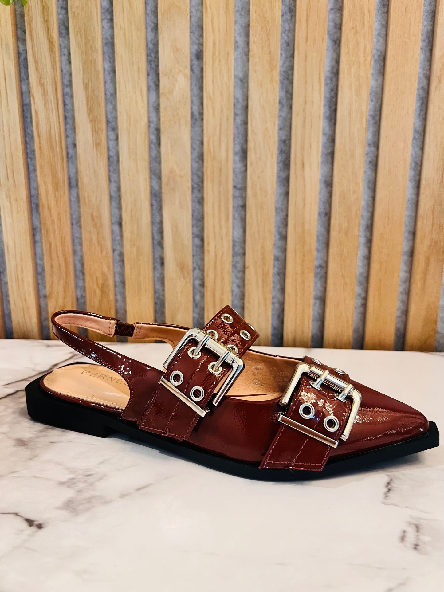Brown pointed sneaker with silver studs
