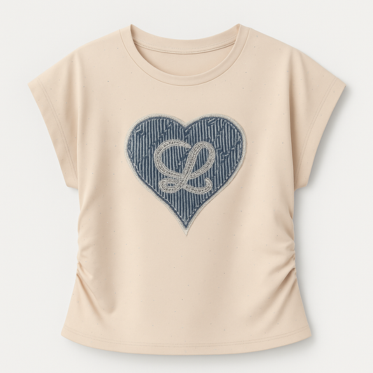 Plus beige blouse with short sleeves and a heart in jeans and pearls