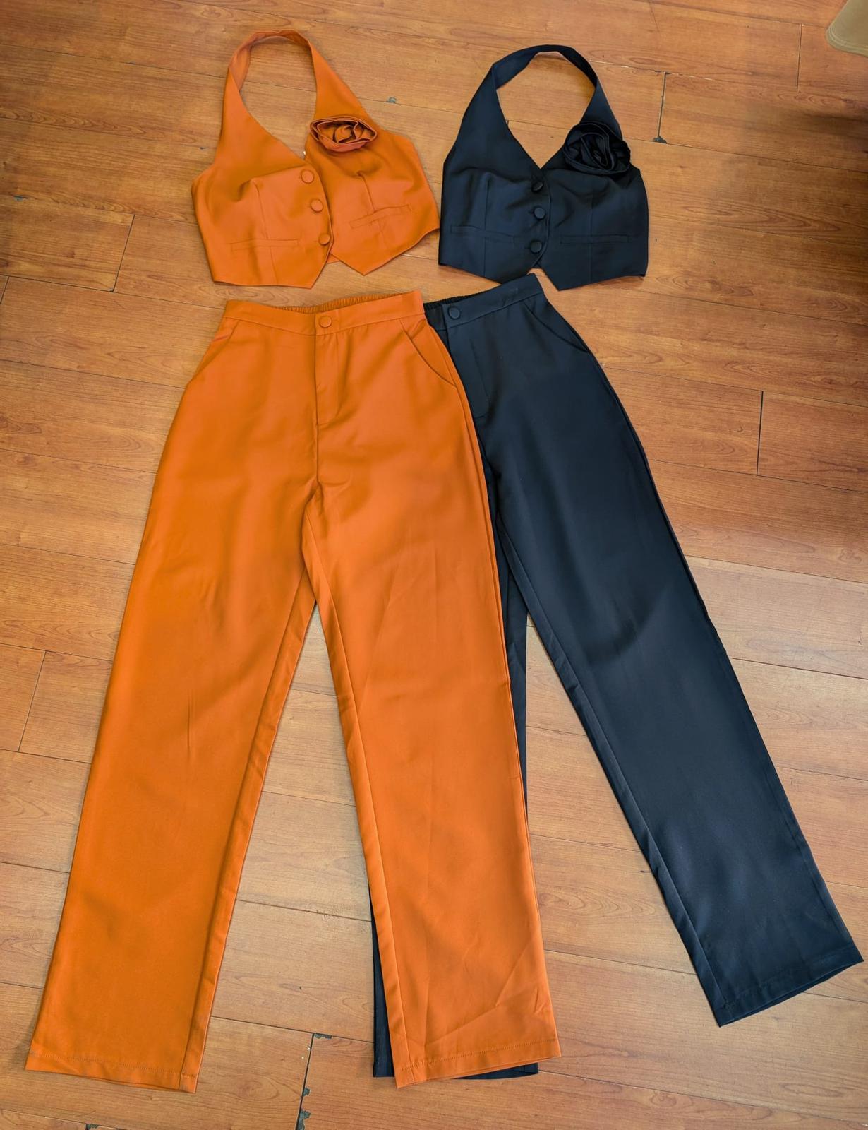 Black set top open at back and flower in the same fabric
